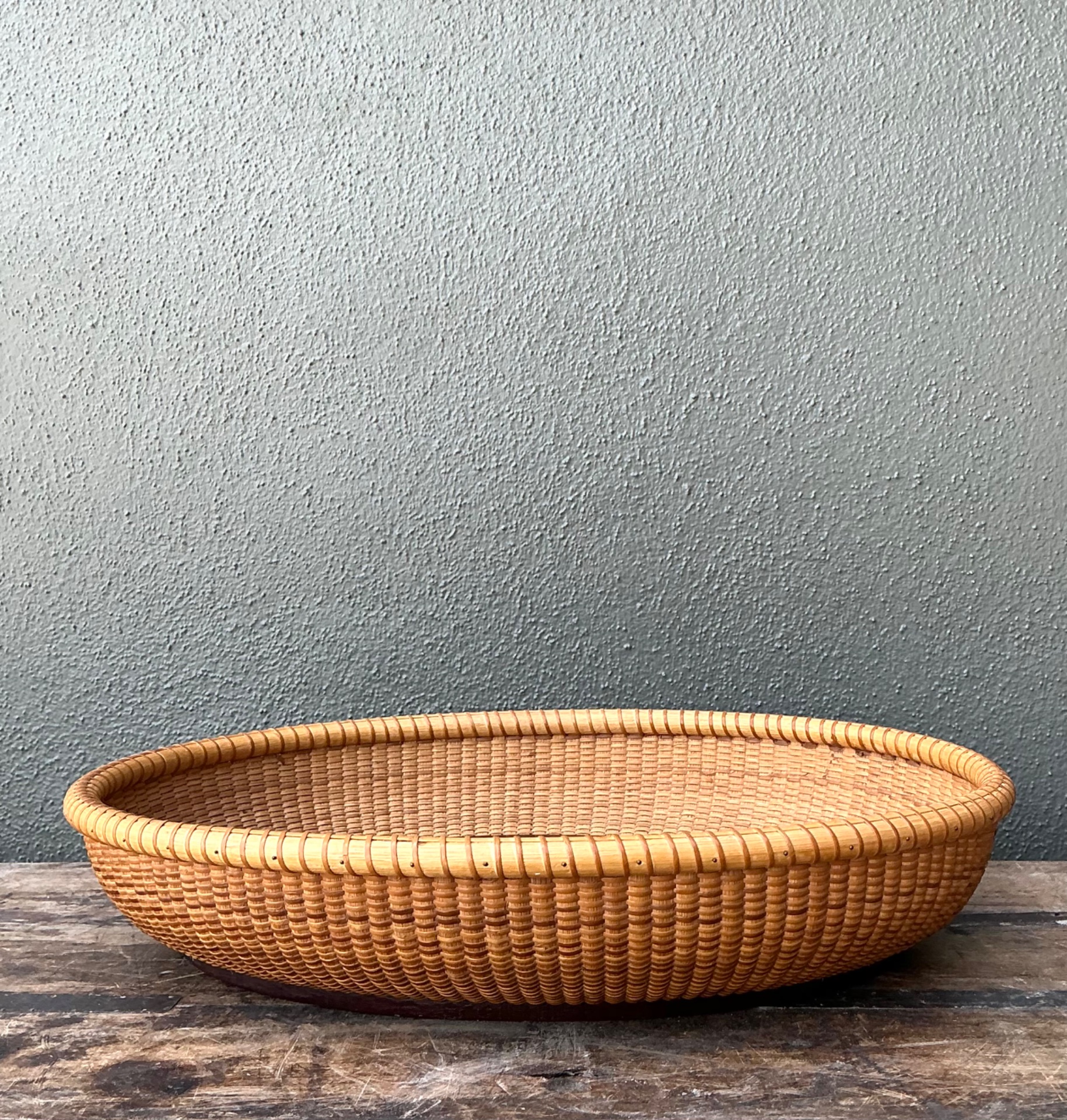 Vintage Rattan Woven Nantucket Basket With Wood Base - Side view
