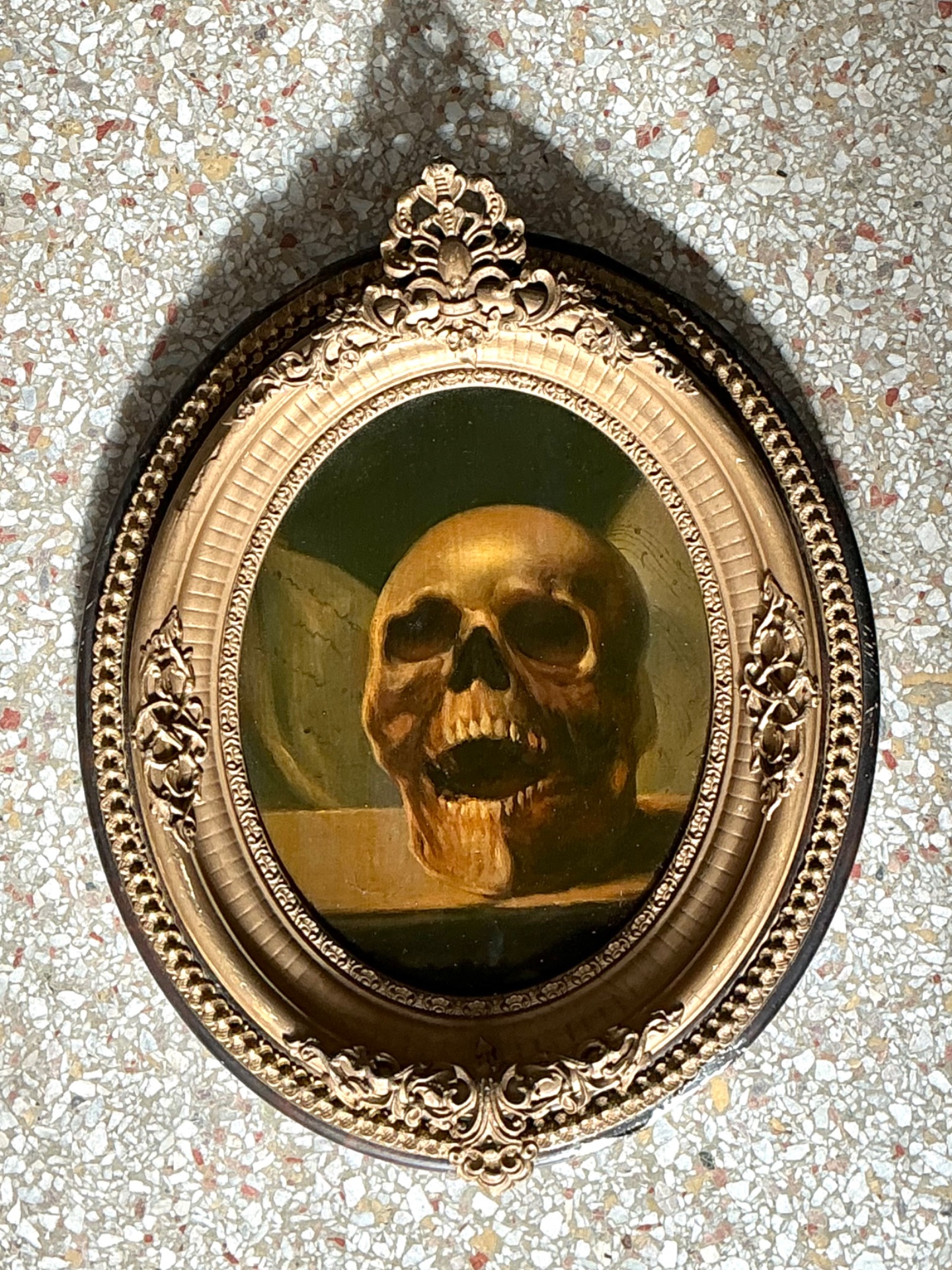 Vintage Skull Oil Painting in Ornate Frame - Top view