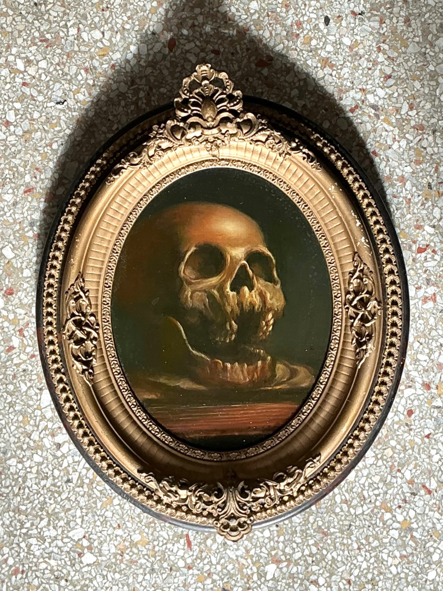 Vintage Skull Oil Painting in Ornate Frame - Top view