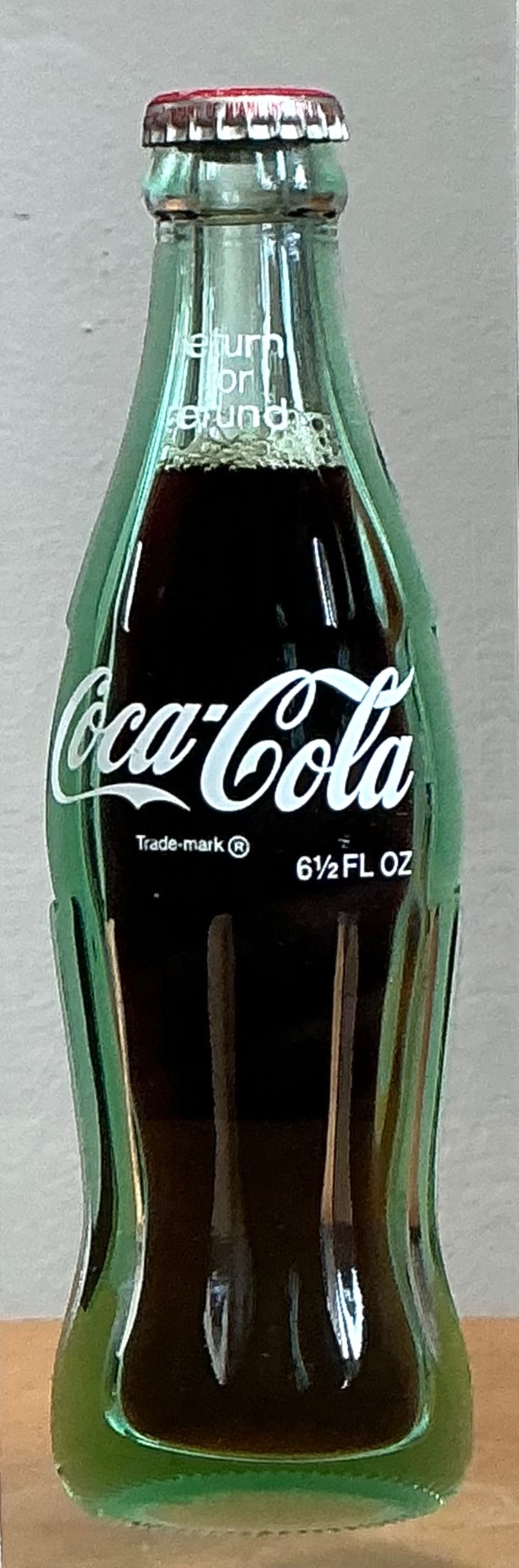 Vintage Coca-Cola Bottle in Lucite Block - Side view