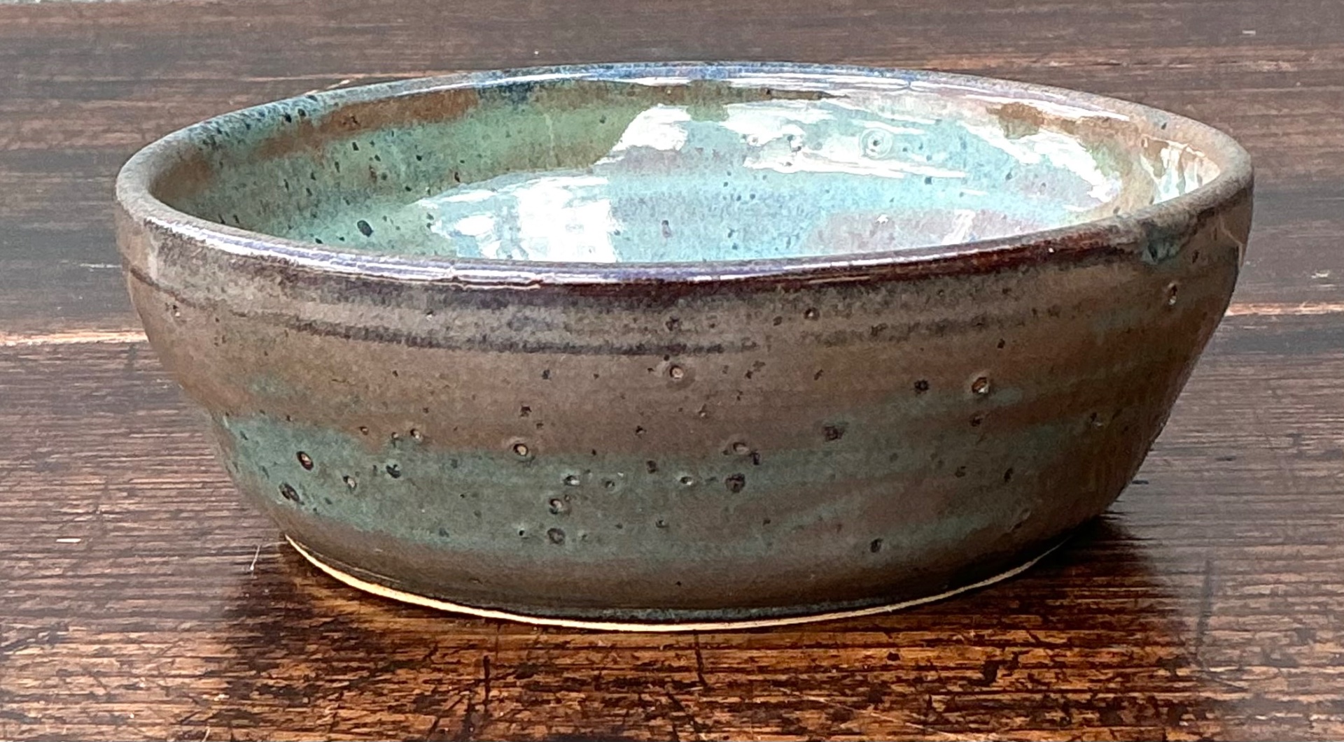 Handcrafted Speckled Green Ceramic Bowl - Detail view