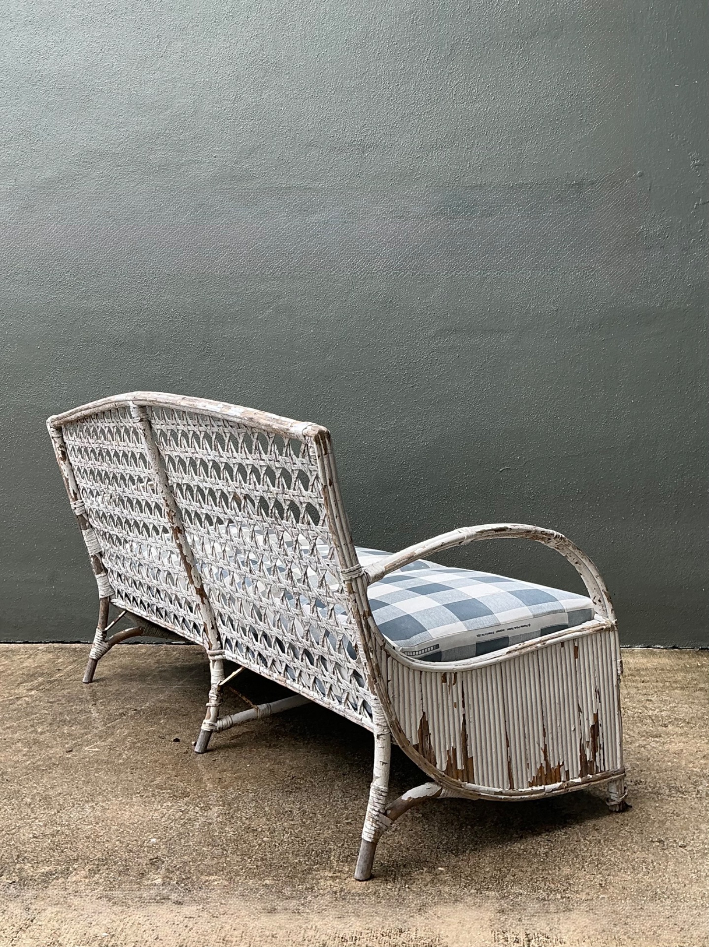 Vintage Distressed White Rattan and Checkered Sofa - Side view