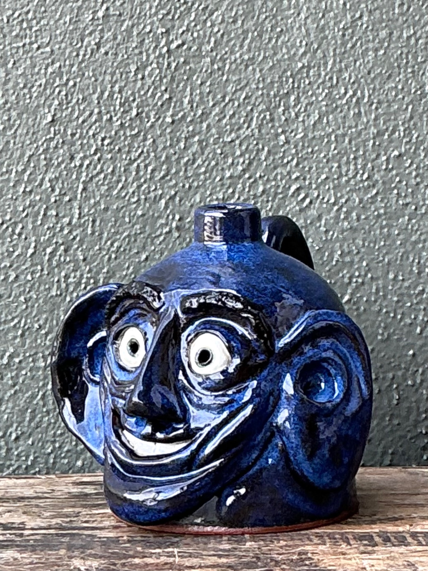 Vintage Blue Glazed Ceramic Face Jug - Top view