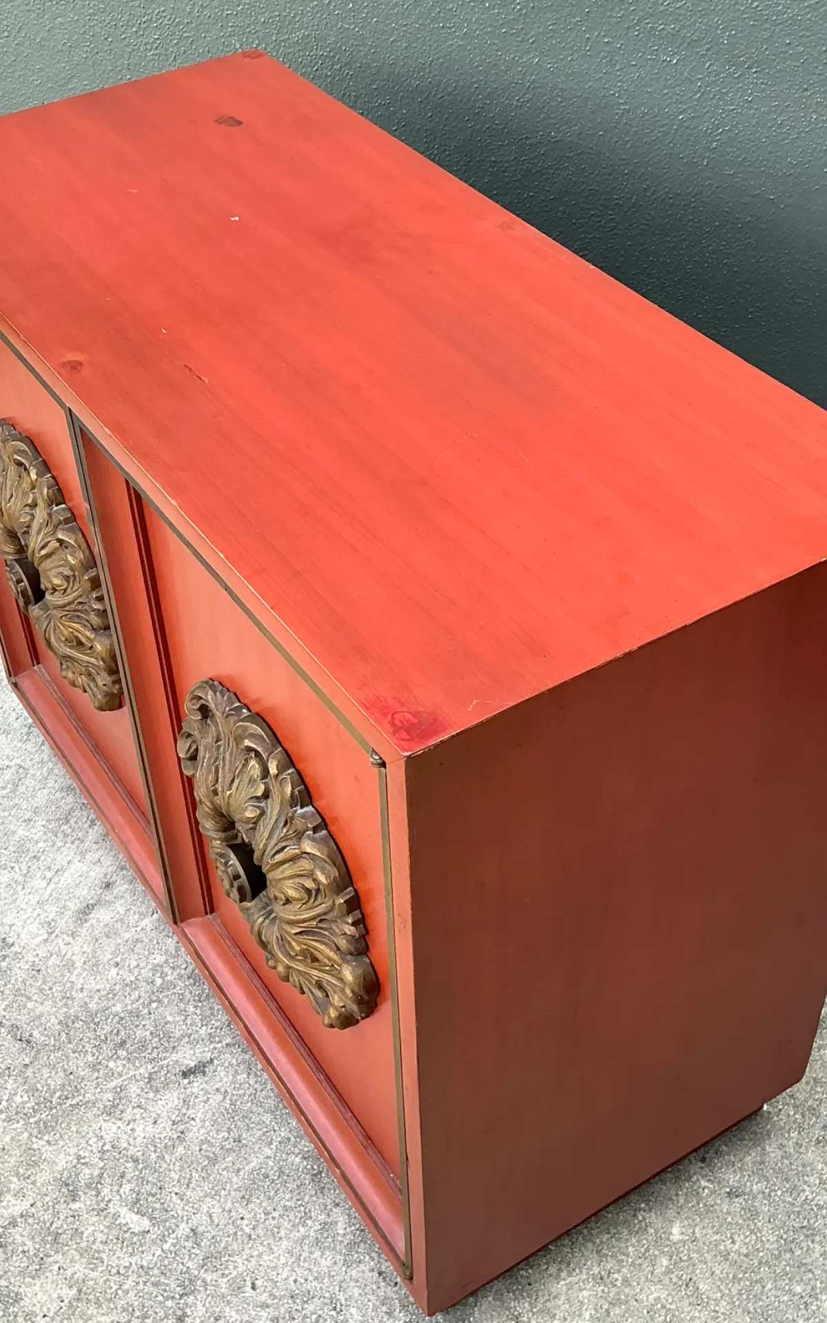 Vintage Lane Red Cabinet with Ornate Medallions - Close-up view