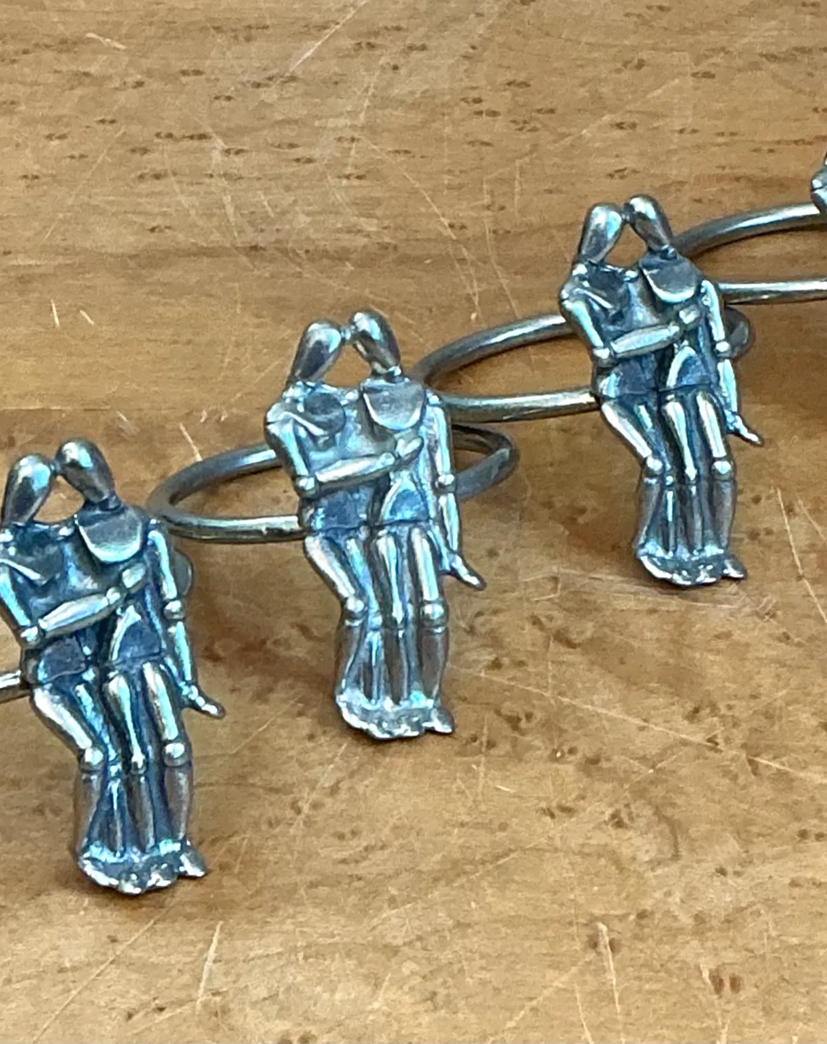 Vintage Embracing Figures Napkin Rings - Back view