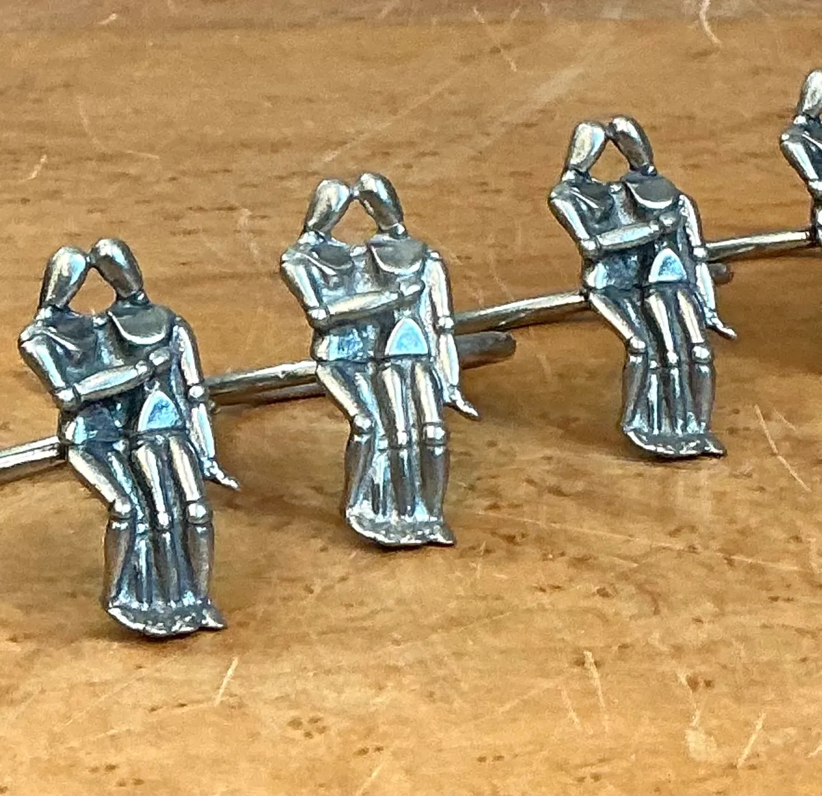 Vintage Embracing Figures Napkin Rings - Close-up view