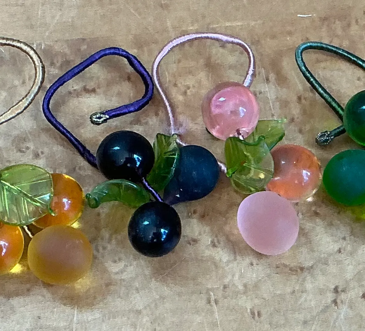 Vintage Glass Fruit Charms with Leaves Napkin Rings - Close-up view