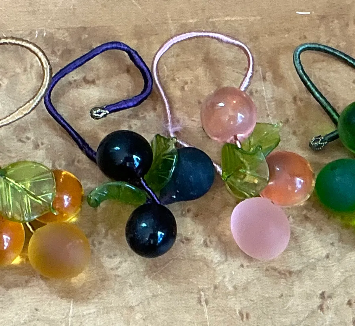 Vintage Glass Fruit Charms with Leaves Napkin Rings - Angle view